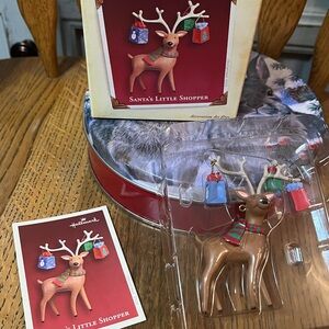 Hallmark Festive Reindeer Ornament with “Santa’s Little Shopper”. New in Box 🦌🦌🦌